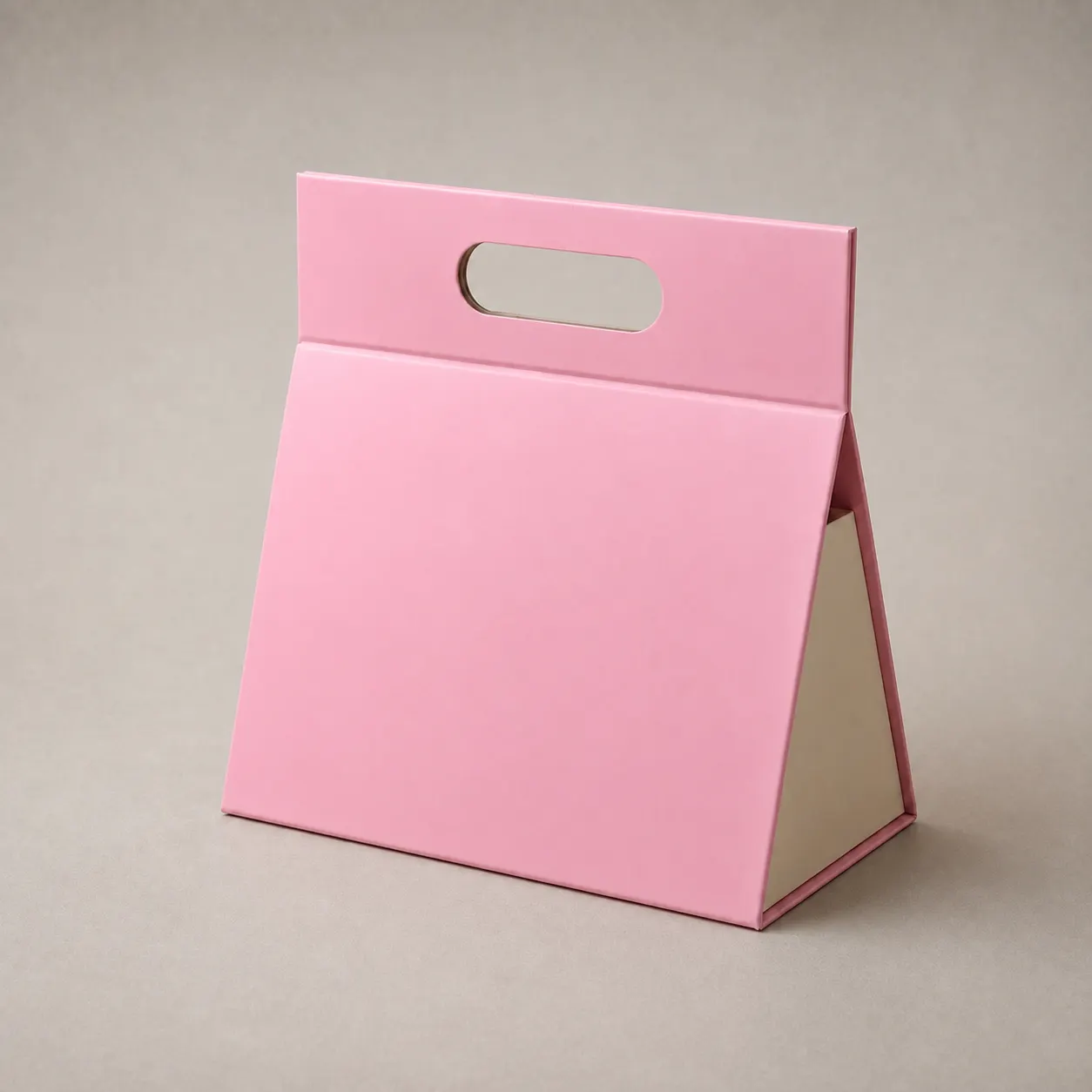 Soft Pink Triangular Handbag-Style Folding Gift Box with Built-In Handle — image 1 of 4